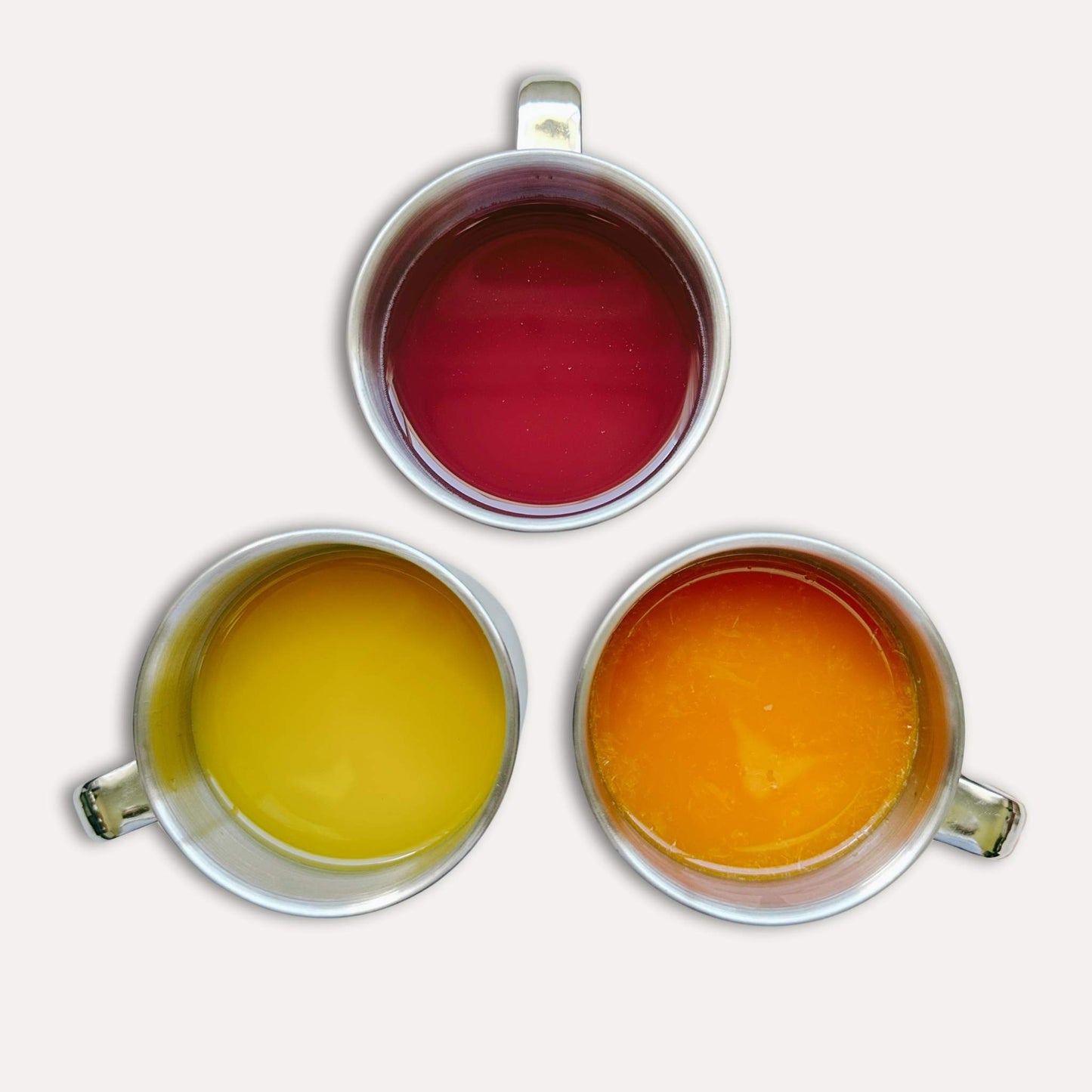 Greenvyne kids stainless steel mugs set 250ml three pack filled with juice.