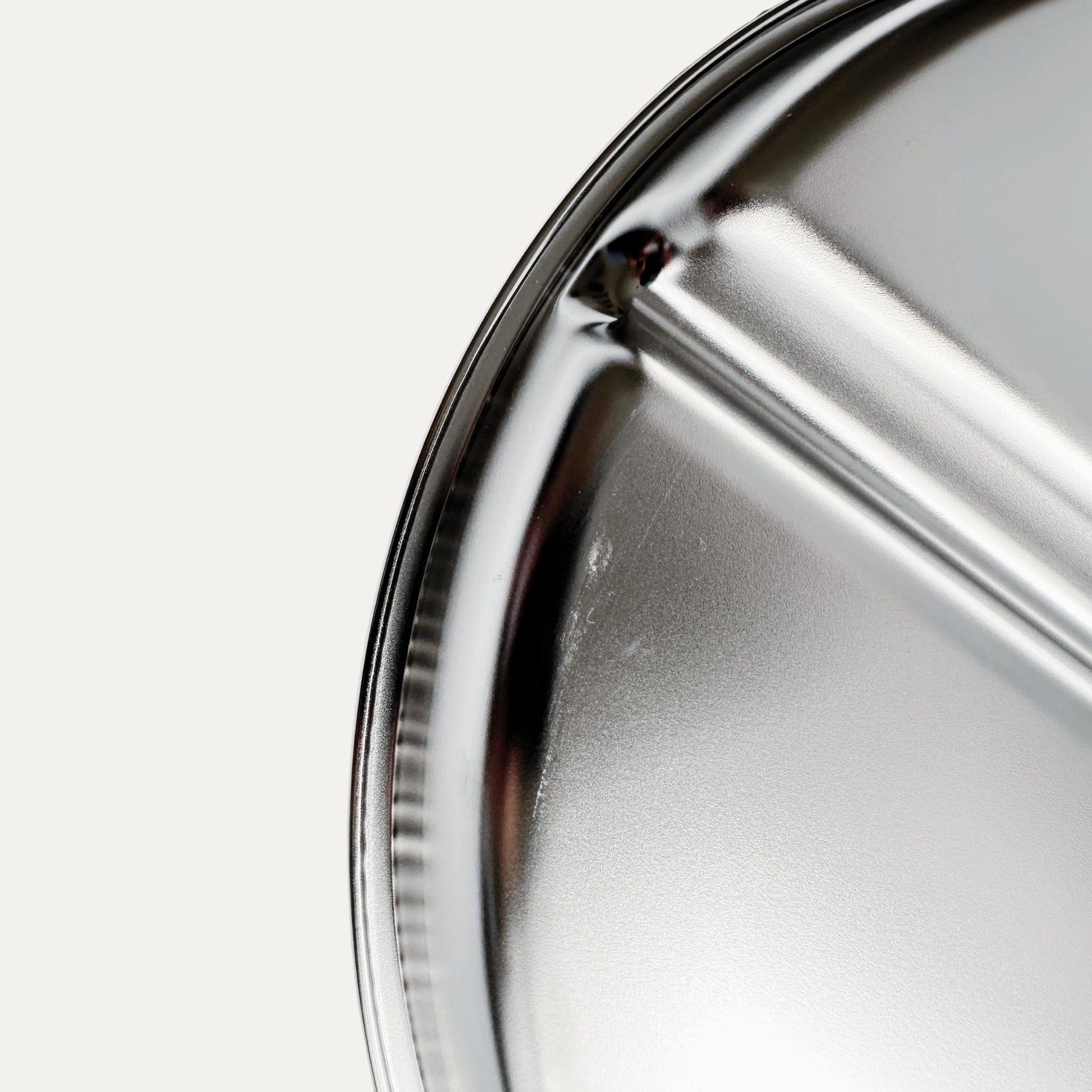 Kids stainless steel round divided plate – closeup of minor cosmetic imperfection (factory seconds).