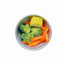Top view of a medium-sized (13.5cm) kid's stainless steel bowl with food, showcasing safe, non-toxic, durable mealtime essentials for babies and toddlers.