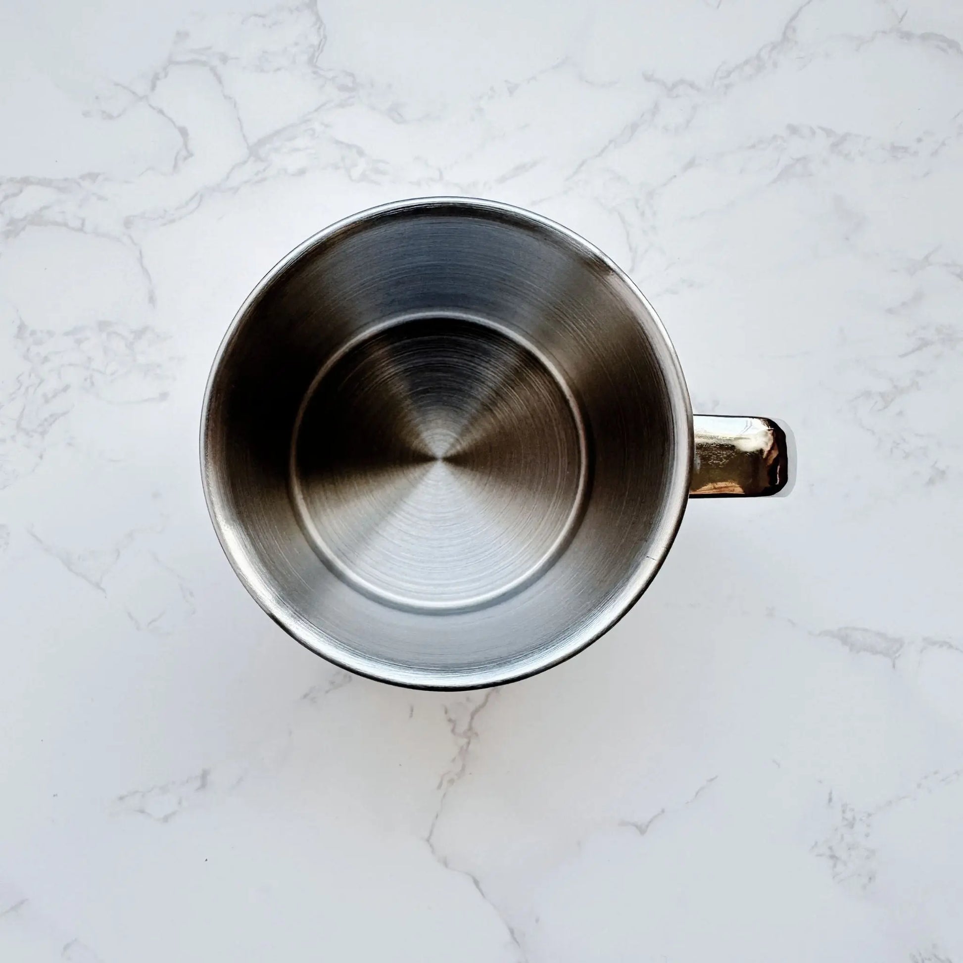 Top view of a 250ml stainless steel mug, showcasing its smooth, non-toxic interior and durable design for eco-friendly drinking.
