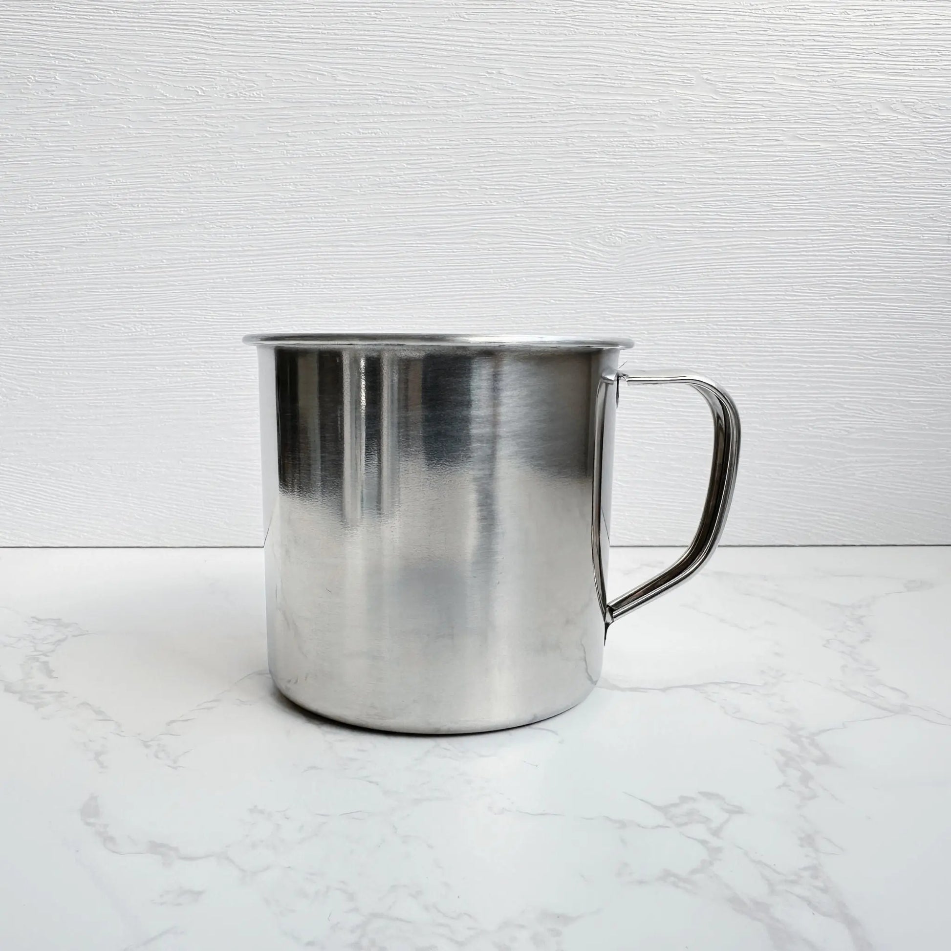 Side view of a 250ml stainless steel mug, showcasing its smooth, non-toxic interior and durable design for eco-friendly drinking.