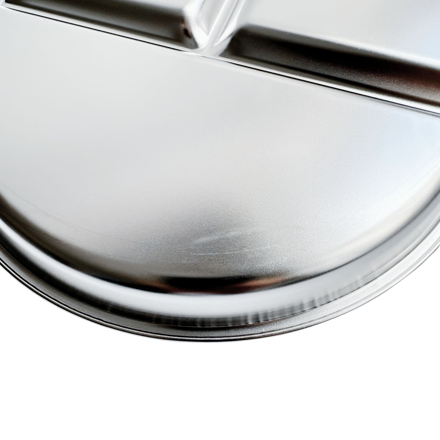 Kids stainless steel round divided plate – closeup of minor cosmetic imperfection (factory seconds).