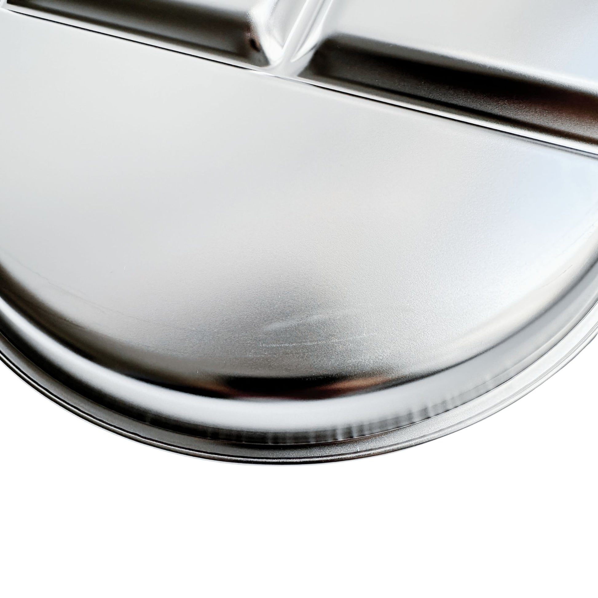 Kids stainless steel round divided plate – closeup of minor cosmetic imperfection (factory seconds).