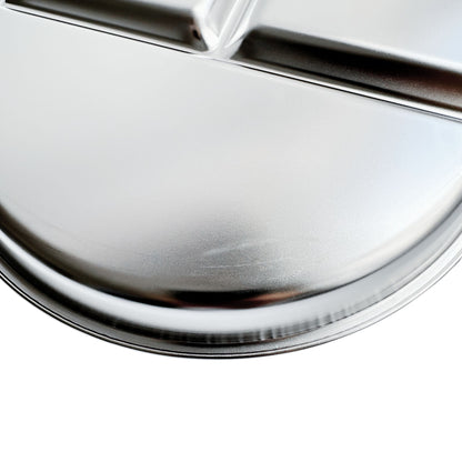 Kids stainless steel round divided plate – closeup of minor cosmetic imperfection (factory seconds).