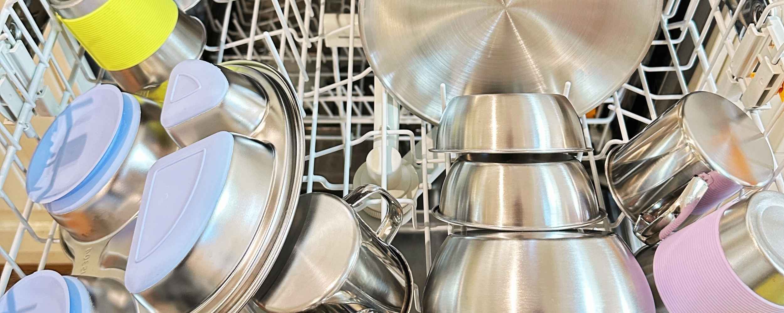 Kids stainless steel tableware stacked in dishwasher - Greenvyne
