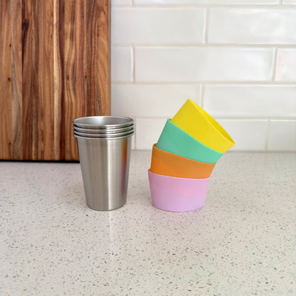 350ml stainless steel kids cups with removable non-slip FDA silicone bands in Apricot, Seafoam, Wattle and Lavender. BPA Free
