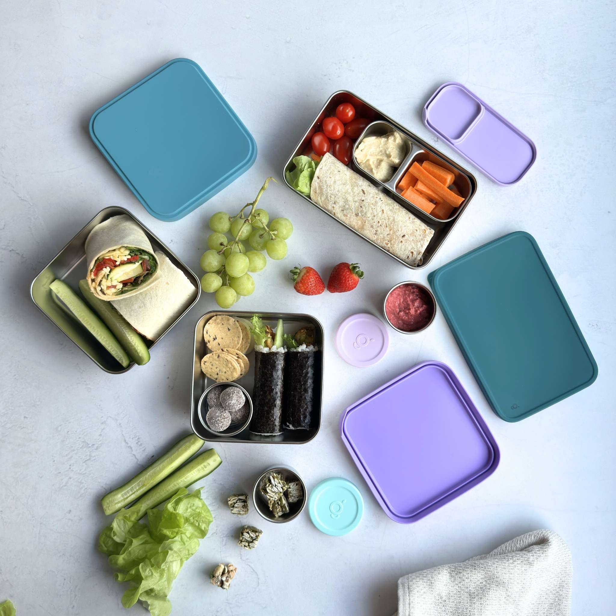 Stainless steel 304 grade square lunch box 650ml, rectangular lunchbox 800ml, dip pot 75ml with packed lunch and sandwich. LFGB-certified Silicone Lid. BPA-free, plastic free, Greenvyne.