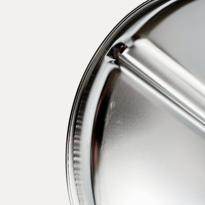 Kids stainless steel round divided plate – closeup of minor cosmetic imperfection (factory seconds).